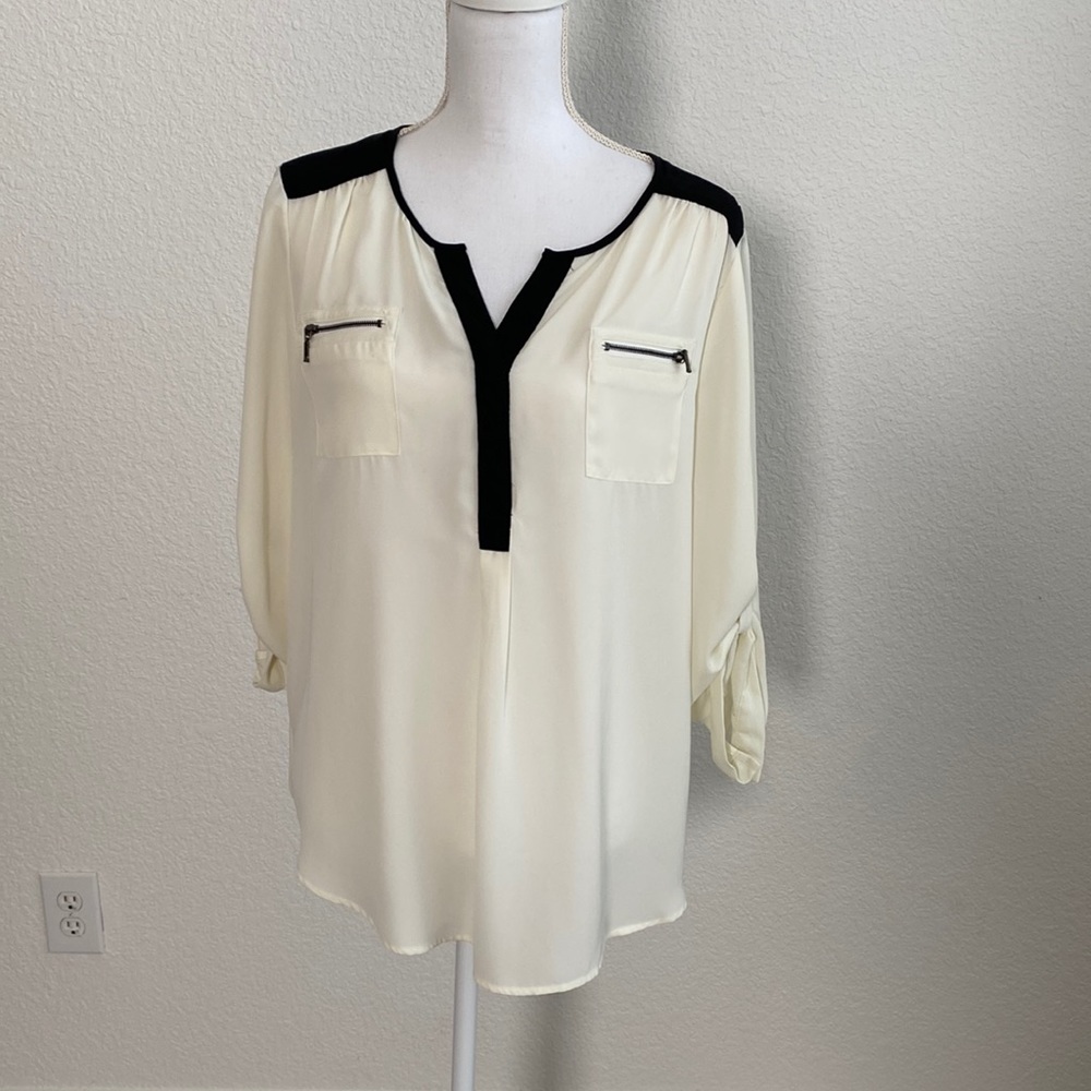 Cream and black blouse